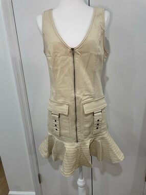 Sleeveless Zip-Front Ruffle Hem Dress in Cream